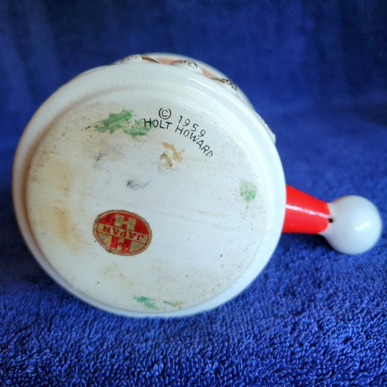 Underside of Holt Howard Starry-Eyed Santa Daisy-eye stick handle mug.