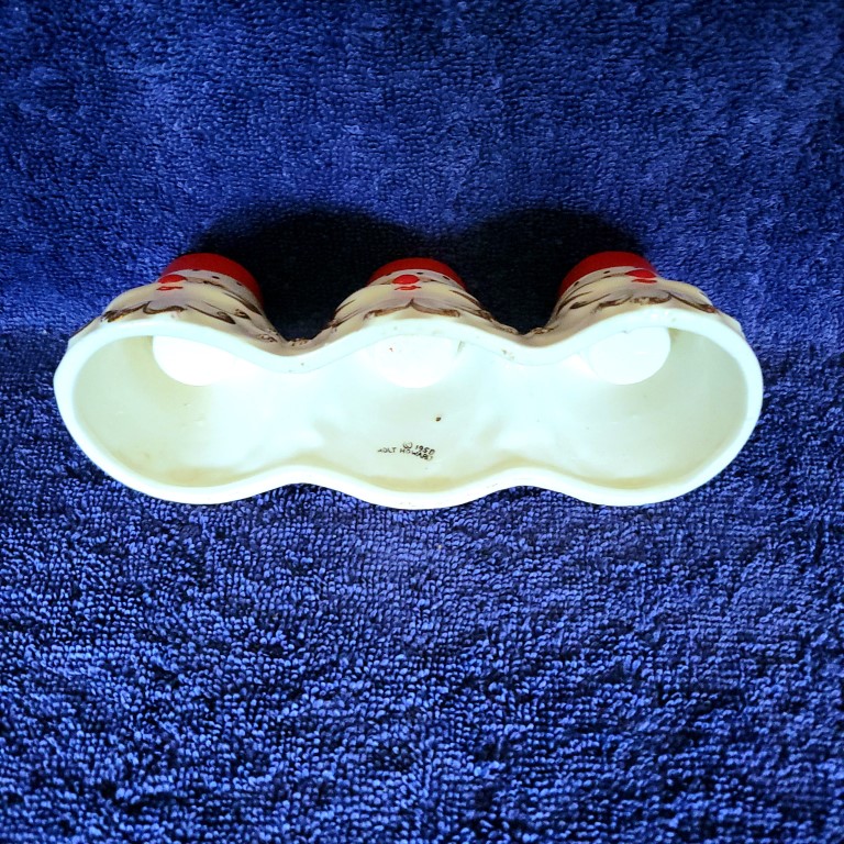Underside of Daisy-eye Holt Howard Starry-Eyed Santa Triple Candle Holder.