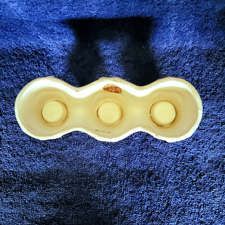 Underside of Atomic-eye Holt Howard Starry-Eyed Santa Triple Candle Holder.