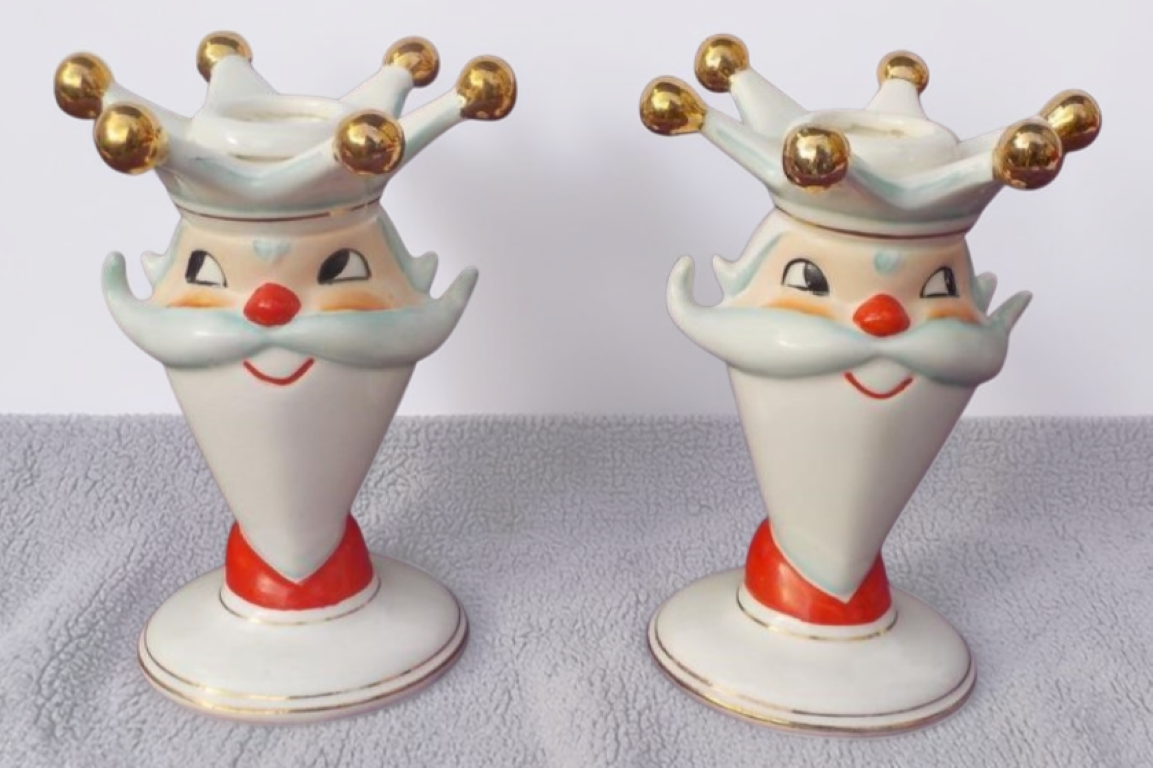 Pair of King Santa candleholders.