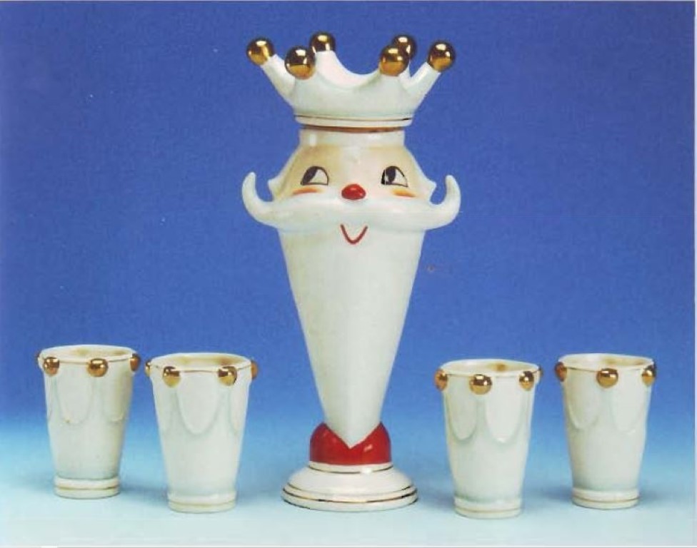 King Santa decanter with four crown-shaped shot glasses.