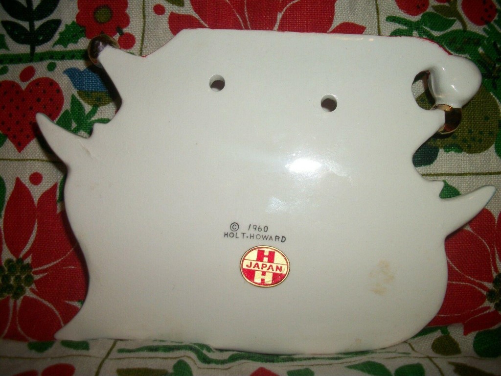 Back of King Santa wall pocket showing hanging holes and markings.